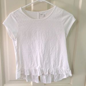 white swiss dot ruffle hem top